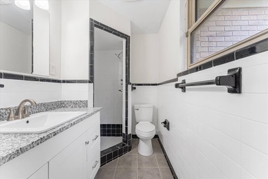 Solid brick 4-bed/2-bath with a flexible nine-room layout-living