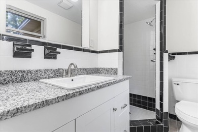 Solid brick 4-bed/2-bath with a flexible nine-room layout-living