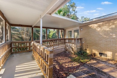 Solid brick 4-bed/2-bath with a flexible nine-room layout-living