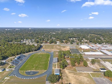 Solid brick 4-bed/2-bath with a flexible nine-room layout-living