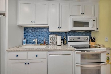 Architecturally stunning unit in the iconic Village Plaza! Built