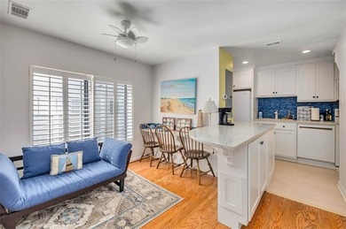 Architecturally stunning unit in the iconic Village Plaza! Built