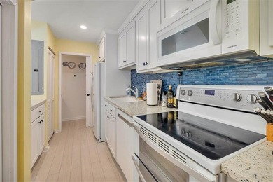 Architecturally stunning unit in the iconic Village Plaza! Built