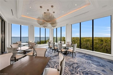 This exquisite residence boasts breathtaking views of the golf