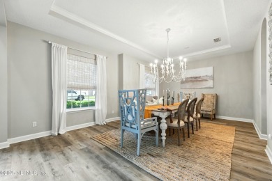 Embrace upscale, waterside living in this stunning two-story, 5