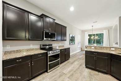 Embrace upscale, waterside living in this stunning two-story, 5