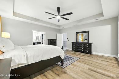 Embrace upscale, waterside living in this stunning two-story, 5