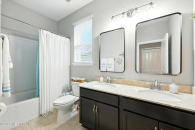 Embrace upscale, waterside living in this stunning two-story, 5