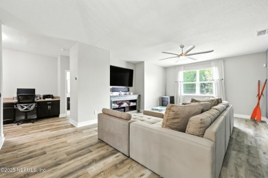 Embrace upscale, waterside living in this stunning two-story, 5