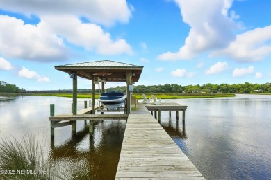 Embrace upscale, waterside living in this stunning two-story, 5