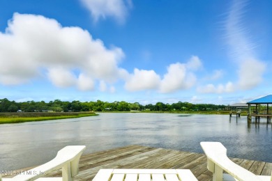 Embrace upscale, waterside living in this stunning two-story, 5