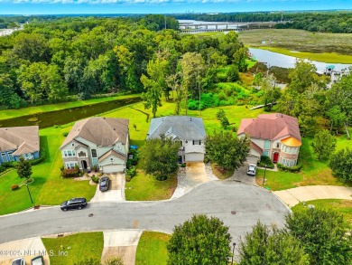 Embrace upscale, waterside living in this stunning two-story, 5