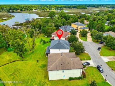 Embrace upscale, waterside living in this stunning two-story, 5