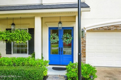 Embrace upscale, waterside living in this stunning two-story, 5