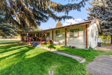 Sitting on nearly a half-acre with water rights to Petty Creek