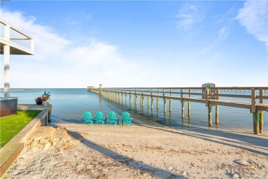 Tucked behind the gates of Sea Shell Shores, lies a home of