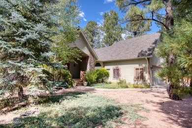 Just steps from Woodland Lake & Park, this lovely home is