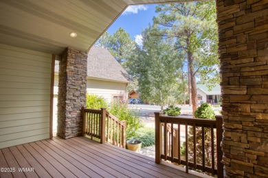 Just steps from Woodland Lake & Park, this lovely home is