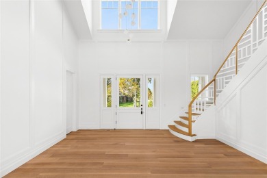 Down a perfectly manicured private road, discover 171 Oneck Lane