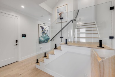 Experience the ultimate in luxury waterfront living with this