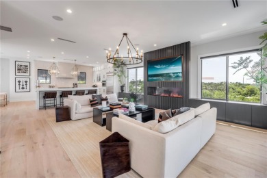 Experience the ultimate in luxury waterfront living with this