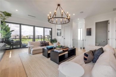 Experience the ultimate in luxury waterfront living with this