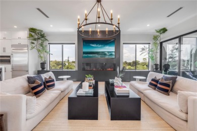 Experience the ultimate in luxury waterfront living with this