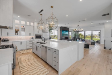 Experience the ultimate in luxury waterfront living with this