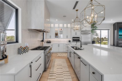 Experience the ultimate in luxury waterfront living with this