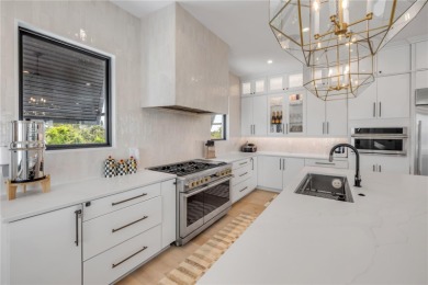 Experience the ultimate in luxury waterfront living with this