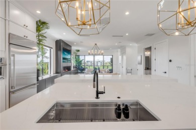 Experience the ultimate in luxury waterfront living with this