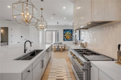 Experience the ultimate in luxury waterfront living with this