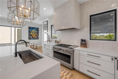 Experience the ultimate in luxury waterfront living with this