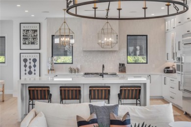 Experience the ultimate in luxury waterfront living with this