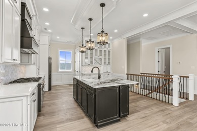 This exceptional new construction in Mariners Pointe blends