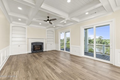 This exceptional new construction in Mariners Pointe blends