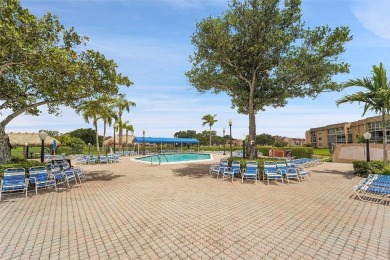 Welcome to this bright and spacious third-floor condo in a