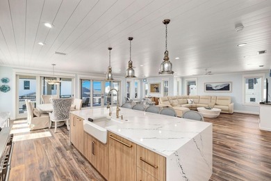 Discover an exquisite home situated on the coveted Sugar Sand