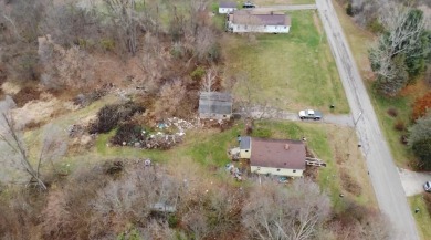 This exceptional 5-acre property offers a rare opportunity to