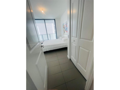 Spacious 1-bed, 1-bath condo furnished (excl. 2 paintings).

