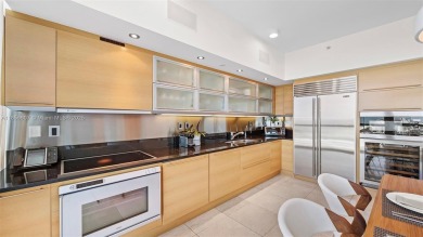 Perched on the 39th floor of The Setai, this stunning 3 bed / 3