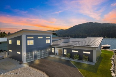 This nearly new, custom-built 4,534 SF waterfront estate along