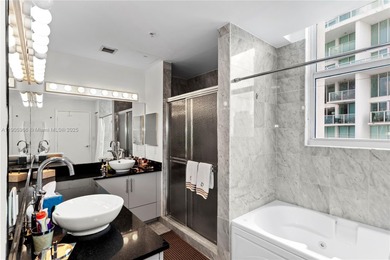 Experience elevated Brickell living in this sun-filled 3-bedroom