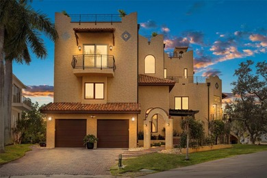 Commanding a premier position at the point of Bayou Grande, this