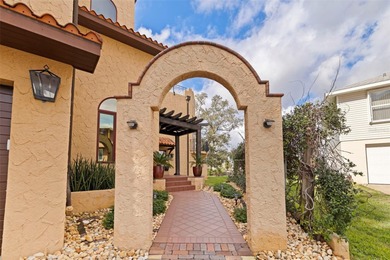 Commanding a premier position at the point of Bayou Grande, this