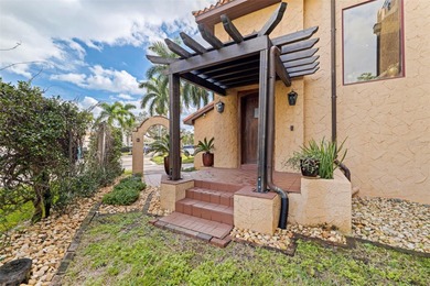 Commanding a premier position at the point of Bayou Grande, this