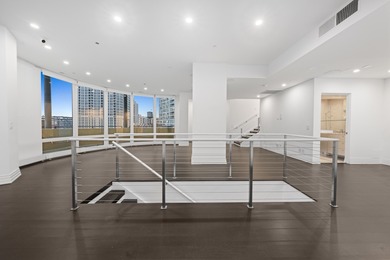 This three-story penthouse at 600 N Kingsbury is a rare