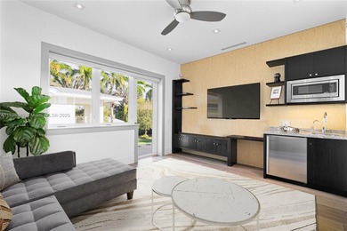 Nestled on nearly an acre in Northeast Pinecrest, this