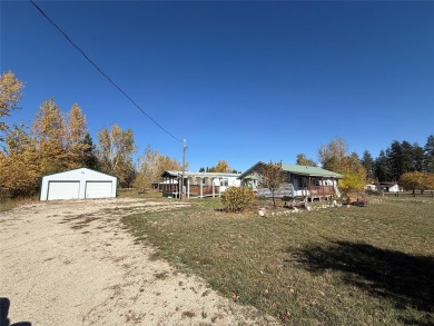 TWO HOMES ON 1.24 ACRES! Welcome to 160 Kootenai Creek Road