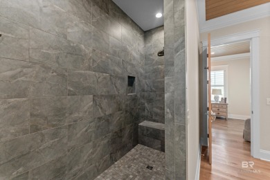 Just steps from the sugar-white sands of the Gulf, this